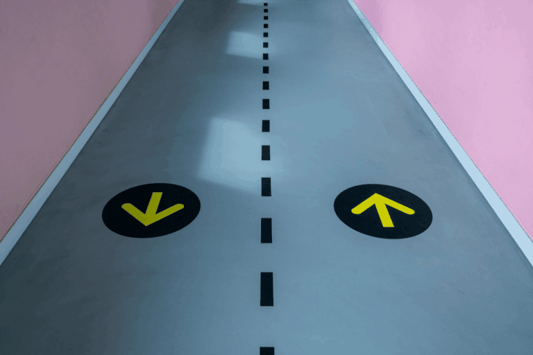 Graphic of single carriageway with arrows pointing in the direction of traffic, symbolising website user experience.