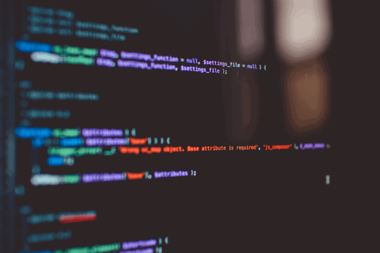 A black computer screen with coloured lines of code to show technical seo